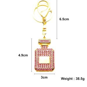 Perfume keychain sprinkled with crystals.